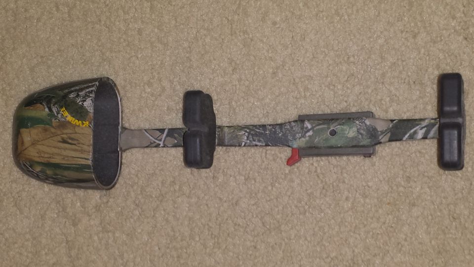Camouflage archery quiver on carpet