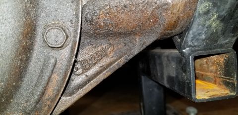 1970 Pontiac GTO — Cast iron part with "B 2512" stamped on it, showing dirt and rust.