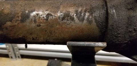 1970 Pontiac GTO — Stamped lettering KDC 083 2 on a dirty metal differential housing.