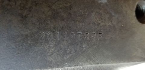 1970 Pontiac GTO — Stamped numbers 201107205 on a dark metal surface with scratch marks.