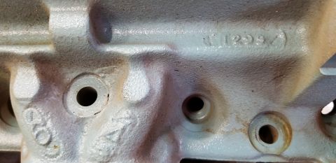 1970 Pontiac GTO — Close-up of a light blue engine block with cast numbers and bolt holes.