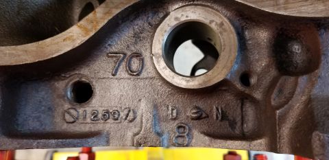 1970 Pontiac GTO — Close-up of engine block casting marks: 70, 12597, 10, 8, circle-slash symbol, N