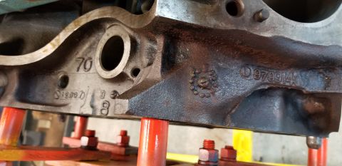 1970 Pontiac GTO — Close-up of a Pontiac engine block with casting numbers '70', 'S12307', '0', '8', and '9799140'.