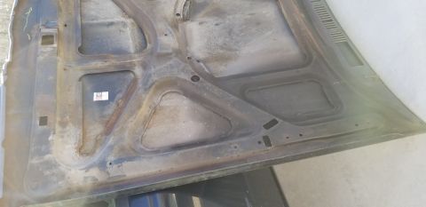 1970 Pontiac GTO — Underside of a car hood showing structural ribs and mounting points.