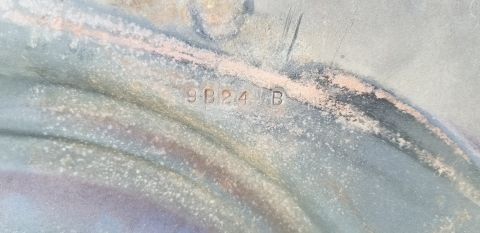 1970 Pontiac GTO — Stamped text '9B24 B' on a weathered blue-grey and pinkish surface.