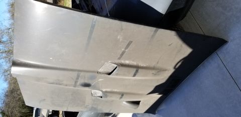 1970 Pontiac GTO — Underside of a dark gray car hood with two vents.