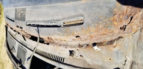 1970 Pontiac GTO — Heavily rusted vehicle cowl panel with VIN tag 3423701107295