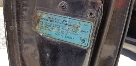 1970 Pontiac GTO — Vehicle identification sticker showing manufacture date 10/69 and GM logo.