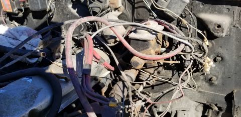 1970 Pontiac GTO - A close-up view of the engine bay of a 1970 Pontiac GTO, showing various engine components, wiring, and hoses. The master cylinder and brak…