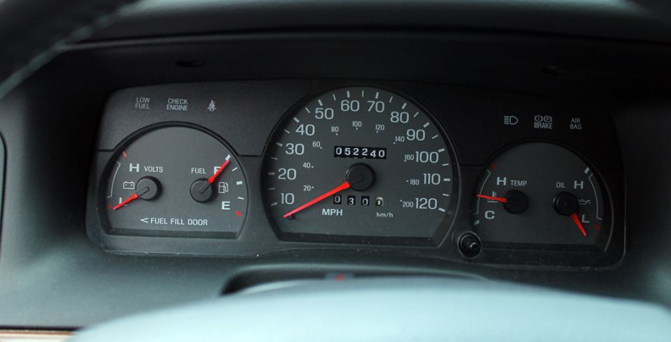 Dashboard gauges showing fuel, volts, speed, odometer, temperature, and oil level