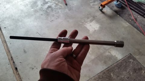 1981 Ford Bronco - A hand holds a hex bit socket wrench, a tool commonly used in automotive repair.