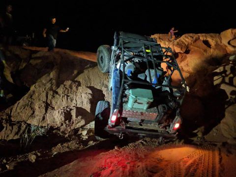 1979 Ford Bronco - This heavily modified off-road vehicle navigates a challenging rocky terrain in the dark.