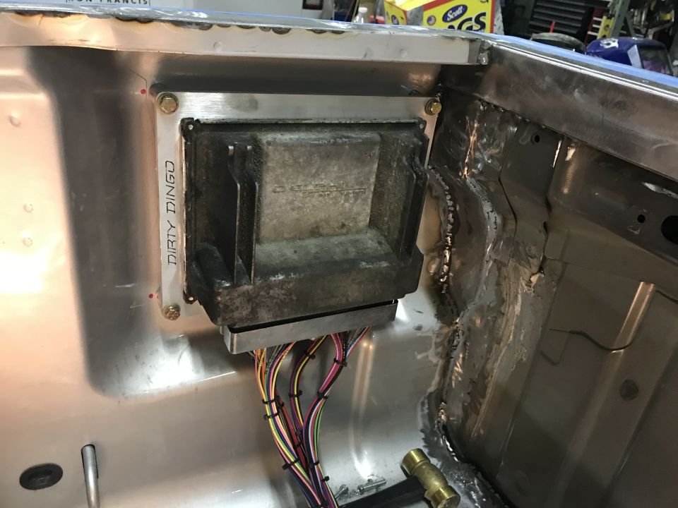 close-up of vehicle wiring and a control module labeled 'DIRTY DINGO'