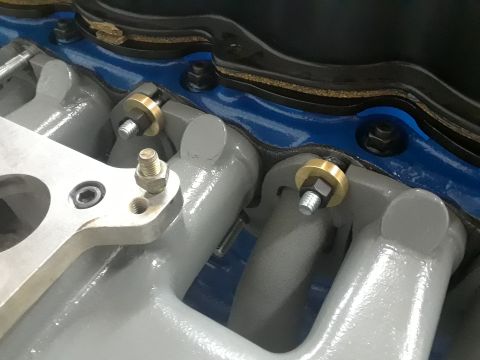 1985 Ford Bronco - Engine intake manifold detail with visible Supermotors.net watermark.