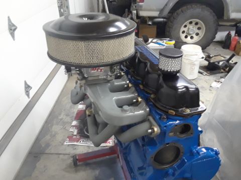 1985 Ford Bronco - Engine assembly with aftermarket air intake and exhaust components.