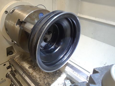 1985 Ford Bronco - Crankshaft pulley being machined on a metal lathe.