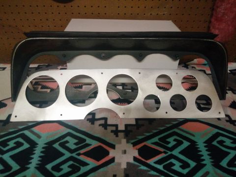 1977 Ford Ranchero - An aftermarket aluminum instrument cluster panel is shown with a black bezel, ready for gauge installation.