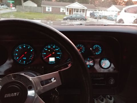 1977 Ford Ranchero - Interior view of a 1977 Ford Ranchero, highlighting the dashboard and aftermarket gauges.