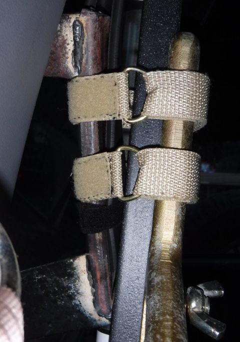 1992 Ford Bronco - Straps are used to secure a Hi-Lift jack to a vehicle's interior structure.