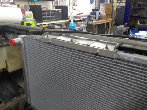 1985 Ford Bronco - Close-up of a vehicle's radiator, likely during a repair or upgrade process.