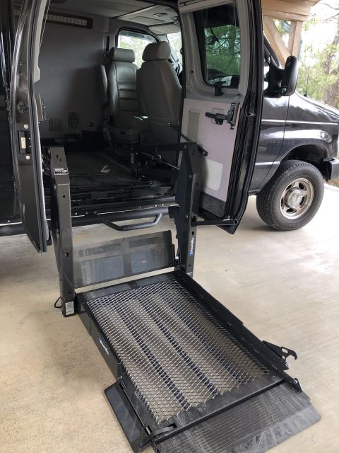 2010 Ford E250 - This 2010 Ford E250 features an extended wheelchair lift, providing accessibility for passengers.