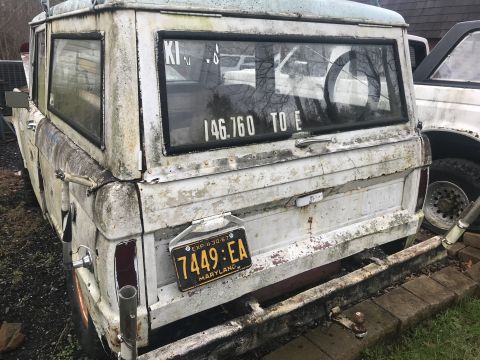 1967 Ford Bronco - This 1967 Ford Bronco shows significant wear and tear, with visible rust and peeling paint.