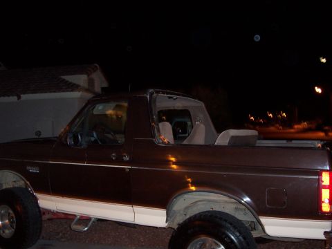 1992 Ford Bronco - This 1992 Ford Bronco is seen from the side at night, with its top removed.