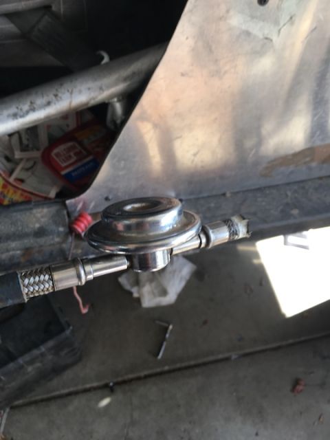 1961 International Scout 800 - Fuel pressure regulator with braided fuel line, likely part of a custom fuel system installation.
