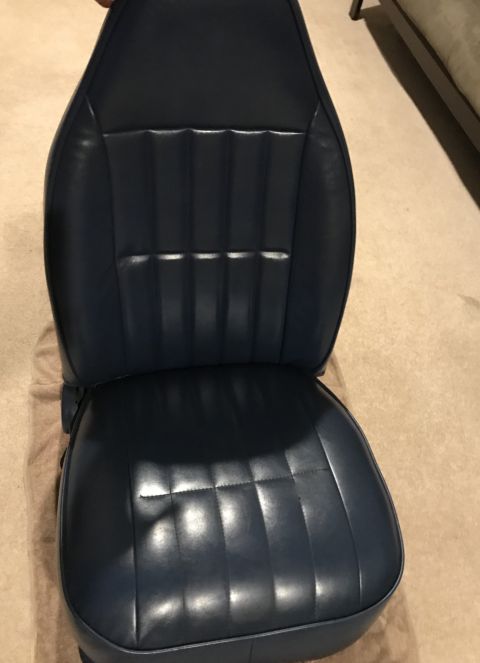 1995 Ford Bronco - A blue vinyl car seat with a quilted pattern is shown from the front.