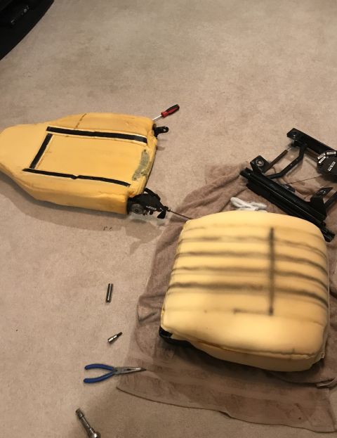1995 Ford Bronco - Car seat foam and frame disassembled on a carpeted floor, with tools nearby. The Supermotors.net logo is visible in the lower right corner.