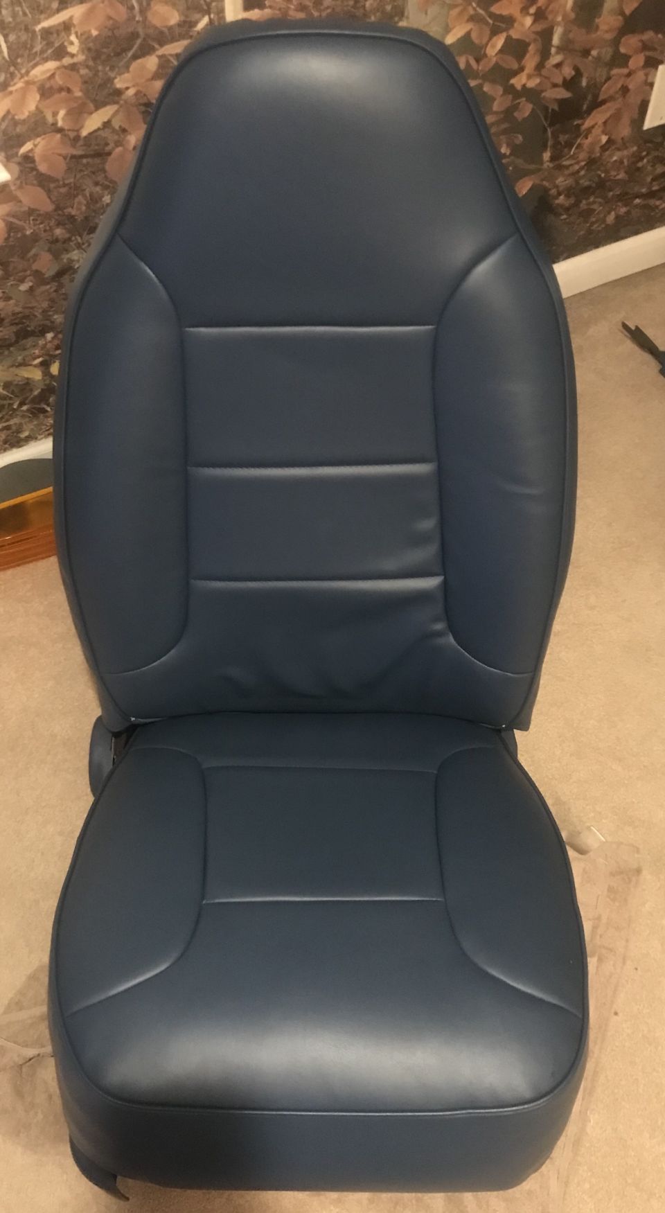 blue leather car seat, looks like it's from a truck or SUV
