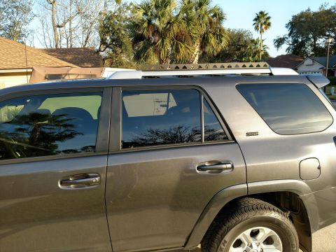 2018 Toyota 4Runner - This Toyota 4Runner is equipped with a roof rack system, seen from the side profile.