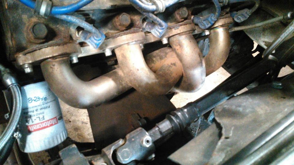 Engine exhaust manifold and Motorcraft FL-1A oil filter