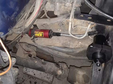 1985 Ford Bronco - Aftermarket KRC fuel filter and regulator installed on a vehicle's undercarriage.