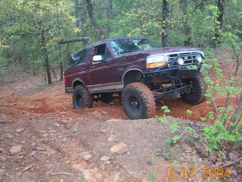 1986 Ford Bronco - This modified Ford Bronco is navigating a challenging off-road course.