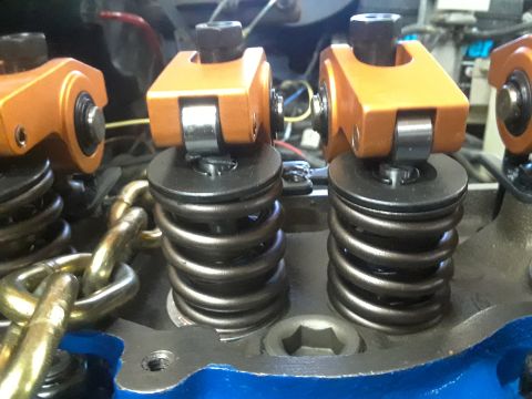 1985 Ford Bronco - Engine valve train components, including roller rocker arms and valve springs, are visible in this close-up.