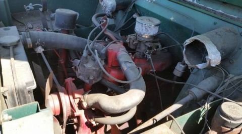1991 Ford Bronco - Close-up view of an engine bay, showing various components and hoses.