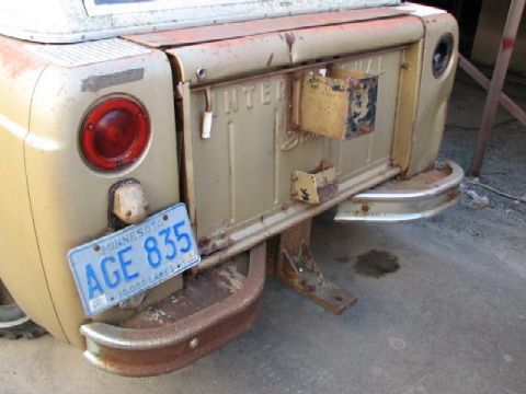 1991 Ford Bronco - The rear of an International Harvester pickup truck, showing the tailgate and bumper, with a Minnesota license plate reading 'AGE 835'.