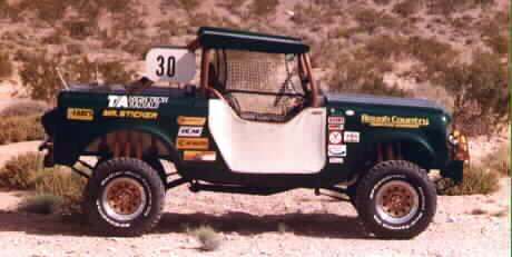 1991 Ford Bronco - This off-road vehicle is covered in various racing decals and has the number 30 displayed prominently.