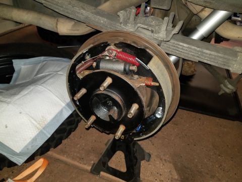1993 Ford Bronco - Close-up of a rear drum brake assembly, likely undergoing maintenance or repair.