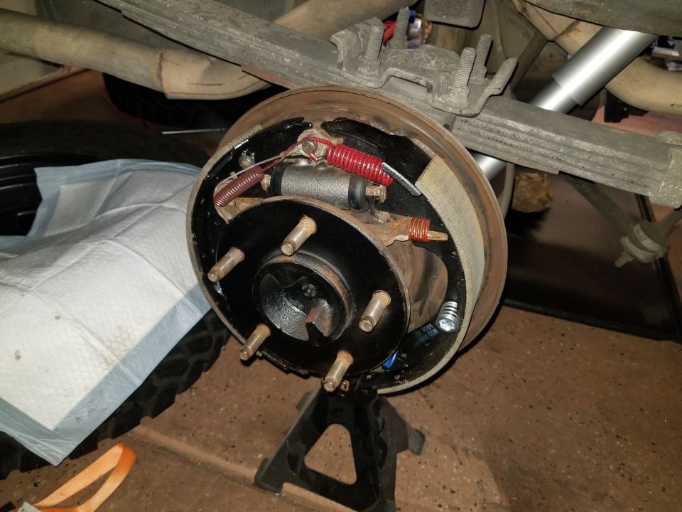 Rear drum brake assembly on jack stand