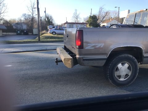 2009 Harley-Davidson FLH - Pickup truck features a Z71 badge and a unique wooden bumper attached to the rear hitch.
