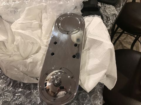 1923 Ford Model T - Unidentified chrome plated automotive part, possibly a cover or housing, wrapped in protective material.