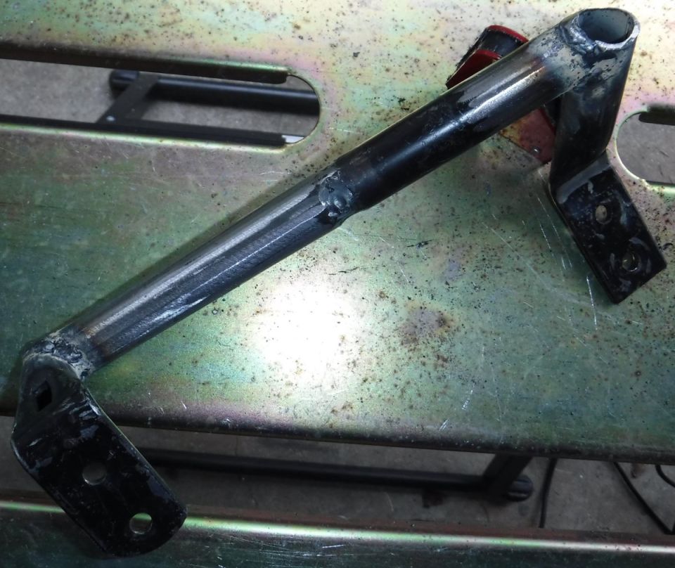 welded metal bracket with two mounting plates
