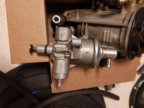 1995 Ford F-250 - A close-up view of a fuel pump assembly, likely a replacement part, is shown.