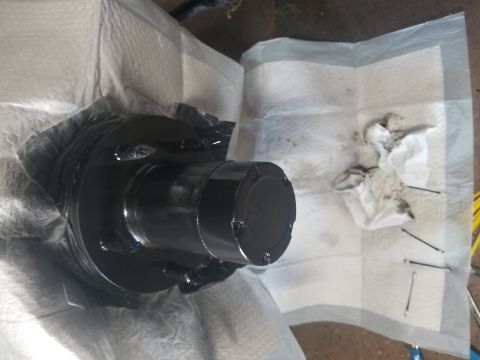 1993 Ford Bronco - A freshly painted vehicle hub assembly sits on paper towels, ready for reinstallation.
