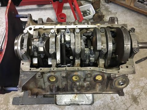 1976 Ford Ranchero - Internal view of an engine block with crankshaft and connecting rods exposed.