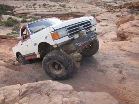 1984 Ford Bronco - This modified Ford Bronco navigates a rocky trail, its off-road capabilities.