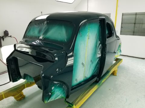1940 Ford Coupe - A 1940 Ford Coupe is prepped and painted in a professional booth, showing its classic body style.