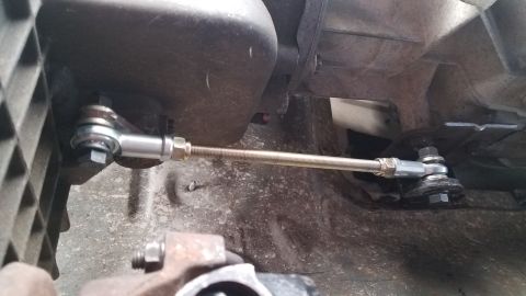 1985 Ford Bronco - Close-up view of a transmission linkage modification, likely for a ZF swap.
